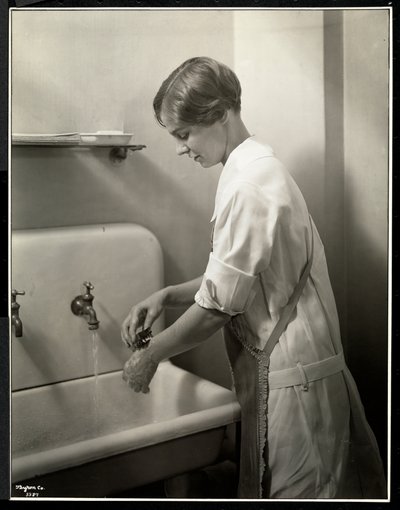 A Nurse Washing Her Hands by Byron Company